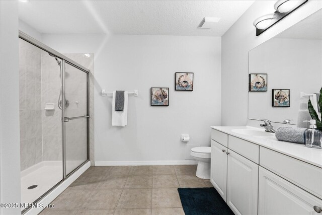 1200 Canopy Walk Ln Unit 1212, Palm Coast, FL 32137 - bathroom with vanity, a shower stall, tile patterned floors, and a textured ceiling