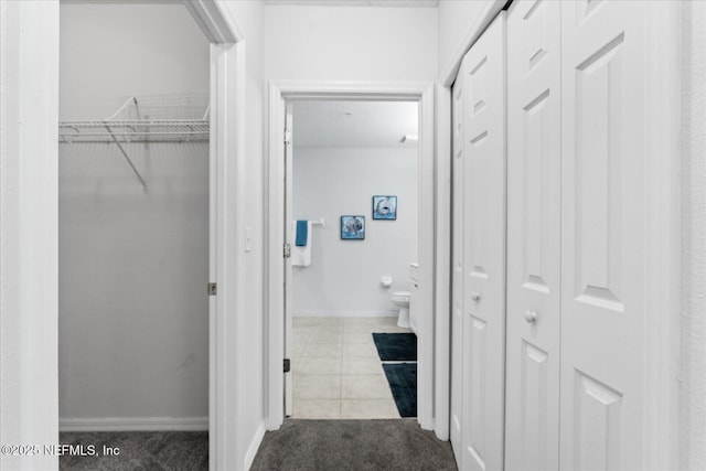 1200 Canopy Walk Ln Unit 1212, Palm Coast, FL 32137 - hallway featuring tile patterned floors and carpet flooring