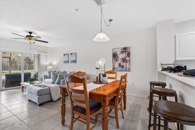 1200 Canopy Walk Ln Unit 1212, Palm Coast, FL 32137 - dining area with ceiling fan, light tile patterned flooring, and a textured ceiling