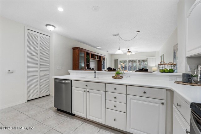 1200 Canopy Walk Ln Unit 1212, Palm Coast, FL 32137 - kitchen with dishwasher, light countertops, white cabinets, and light tile patterned flooring