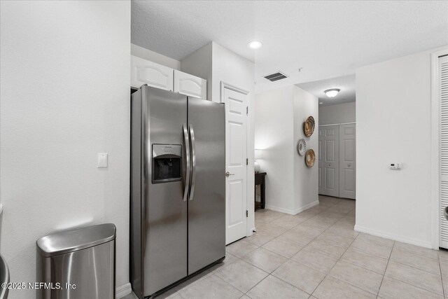 1200 Canopy Walk Ln Unit 1212, Palm Coast, FL 32137 - kitchen with stainless steel fridge with ice dispenser, white cabinetry, light tile patterned floors, and recessed lighting