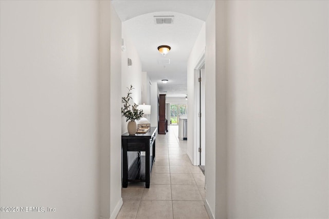 1200 Canopy Walk Ln Unit 1212, Palm Coast, FL 32137 - hall with arched walkways and light tile patterned floors