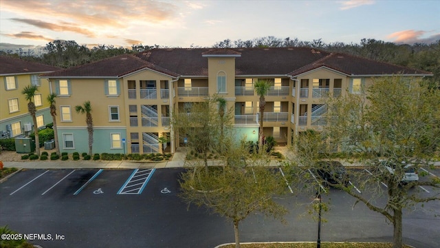 1200 Canopy Walk Ln Unit 1212, Palm Coast, FL 32137 - property at dusk with uncovered parking