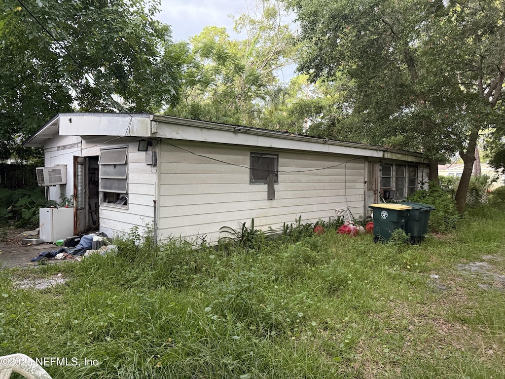 2903 Bratcher Rd, Jacksonville, FL 32224 - view of side of property with an AC wall unit
