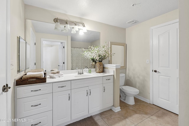 10435 Mid Town Pkwy Unit 265, Jacksonville, FL 32246 - bathroom featuring vanity, tile patterned floors, and a textured ceiling