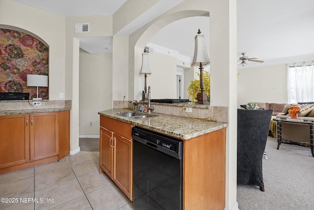 10435 Mid Town Pkwy Unit 265, Jacksonville, FL 32246 - kitchen featuring black dishwasher, open floor plan, light stone counters, a ceiling fan, and brown cabinets