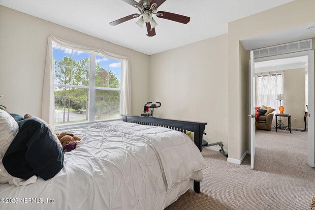 10435 Mid Town Pkwy Unit 265, Jacksonville, FL 32246 - carpeted bedroom featuring baseboards and a ceiling fan