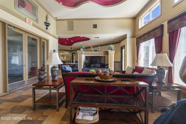 10435 Mid Town Pkwy Unit 265, Jacksonville, FL 32246 - living area with a high ceiling, french doors, stone finish floors, and crown molding