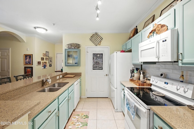 130 Old Town Pkwy Unit 2202, Saint Augustine, FL 32084 - kitchen with white appliances, a peninsula, light tile patterned floors, decorative backsplash, and crown molding