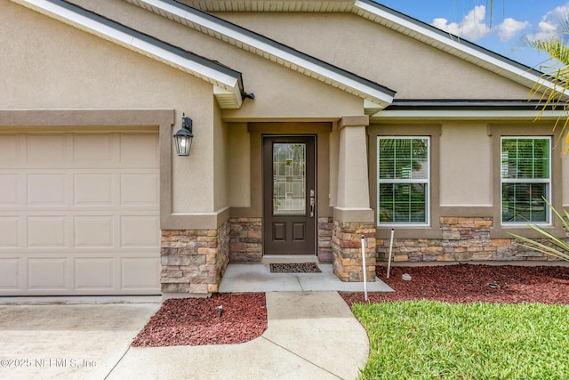 222 Green Turtle Ln, Saint Augustine, FL 32086 - doorway to property with stone siding, stucco siding, an attached garage, and driveway