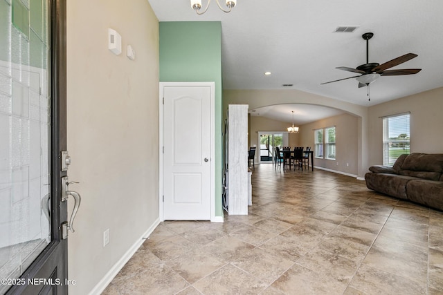 222 Green Turtle Ln, Saint Augustine, FL 32086 - living room with arched walkways, a chandelier, lofted ceiling, and ceiling fan