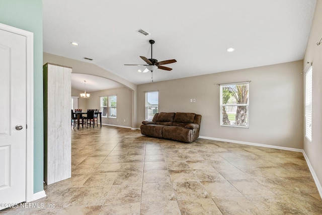 222 Green Turtle Ln, Saint Augustine, FL 32086 - living area featuring a ceiling fan, arched walkways, vaulted ceiling, a chandelier, and recessed lighting