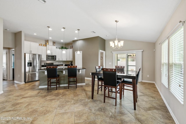 222 Green Turtle Ln, Saint Augustine, FL 32086 - dining space with a chandelier, vaulted ceiling, and recessed lighting
