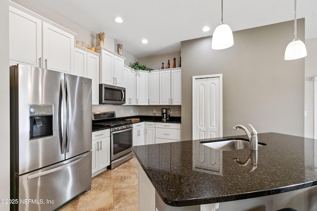 222 Green Turtle Ln, Saint Augustine, FL 32086 - kitchen with stainless steel appliances, white cabinetry, recessed lighting, pendant lighting, and a center island with sink