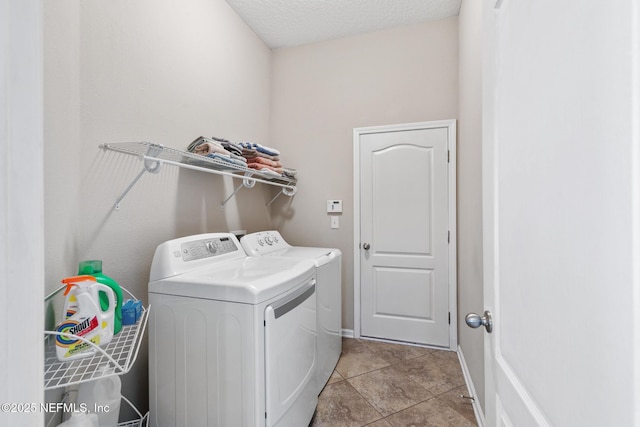 222 Green Turtle Ln, Saint Augustine, FL 32086 - washroom featuring washer and dryer, light tile patterned flooring, and a textured ceiling