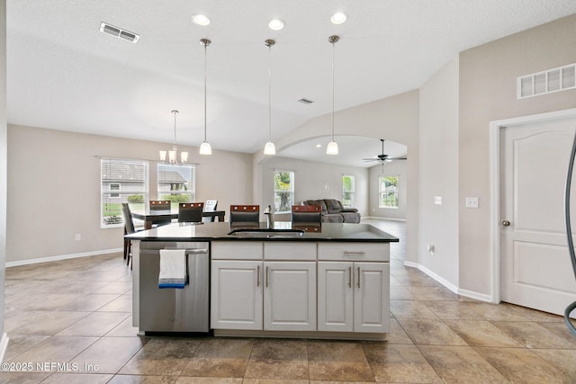 222 Green Turtle Ln, Saint Augustine, FL 32086 - kitchen with dark countertops, stainless steel dishwasher, lofted ceiling, pendant lighting, and a ceiling fan