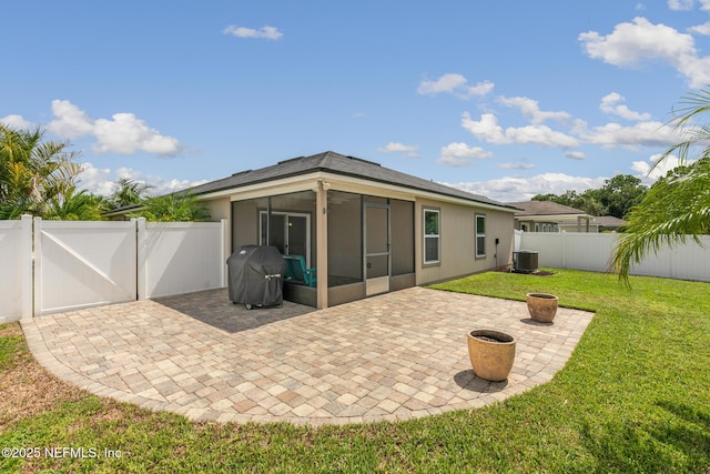 222 Green Turtle Ln, Saint Augustine, FL 32086 - rear view of property featuring a sunroom, a fenced backyard, a gate, and a patio area