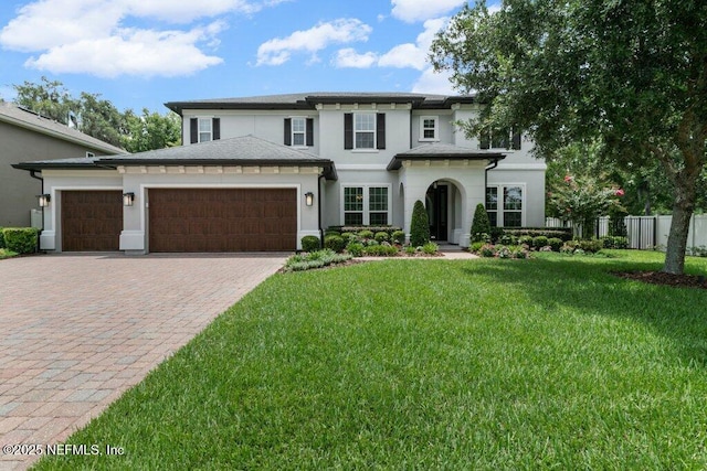 26 Traveler Palm Ct, Ponte Vedra Beach, FL 32082 - view of front of home with stucco siding, a garage, and decorative driveway