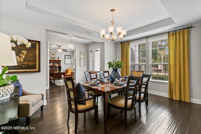 26 Traveler Palm Ct, Ponte Vedra Beach, FL 32082 - dining room featuring a chandelier, a raised ceiling, and dark wood-style flooring
