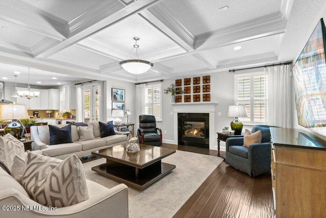 26 Traveler Palm Ct, Ponte Vedra Beach, FL 32082 - living room featuring dark wood-type flooring, a glass covered fireplace, beam ceiling, ornamental molding, and coffered ceiling