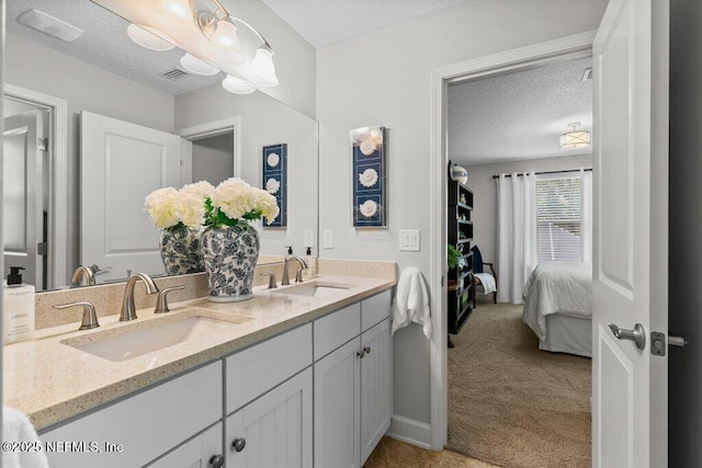 26 Traveler Palm Ct, Ponte Vedra Beach, FL 32082 - ensuite bathroom with double vanity and a textured ceiling