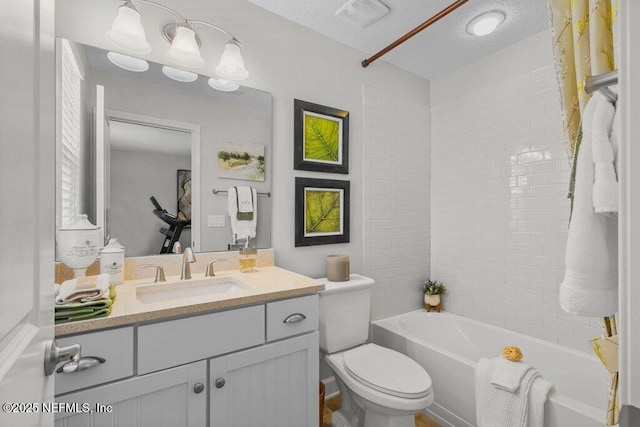 26 Traveler Palm Ct, Ponte Vedra Beach, FL 32082 - full bathroom featuring vanity, tub / shower combination, and a textured ceiling