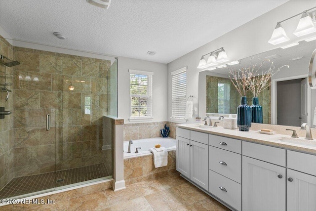 26 Traveler Palm Ct, Ponte Vedra Beach, FL 32082 - bathroom with a bath, double vanity, a shower stall, and a textured ceiling