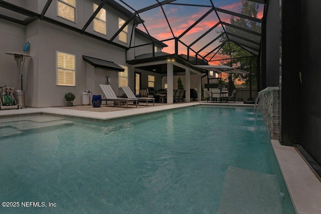 26 Traveler Palm Ct, Ponte Vedra Beach, FL 32082 - pool at dusk with an outdoor pool, a patio area, and glass enclosure