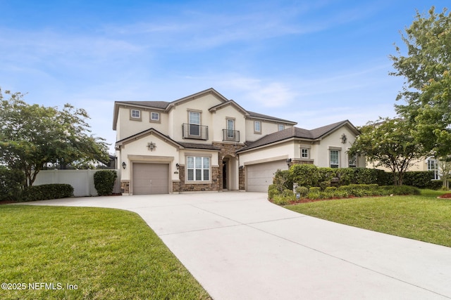 1306 Warbler Way, Middleburg, FL 32068 - traditional-style house featuring stucco siding, stone siding, concrete driveway, and an attached garage