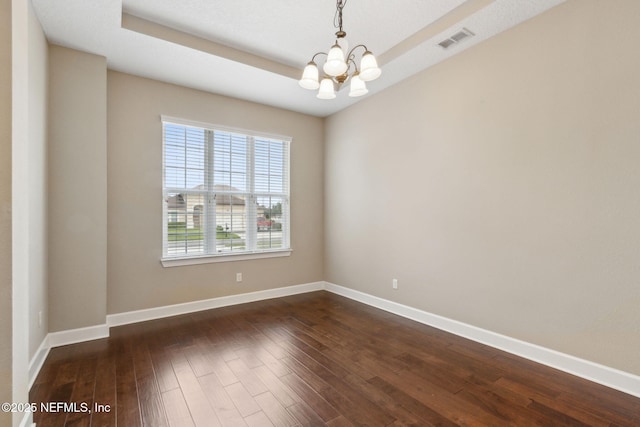 1306 Warbler Way, Middleburg, FL 32068 - empty room featuring a chandelier and dark wood-style flooring