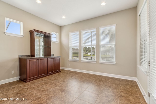 1306 Warbler Way, Middleburg, FL 32068 - unfurnished bedroom with multiple windows, recessed lighting, and tile patterned flooring