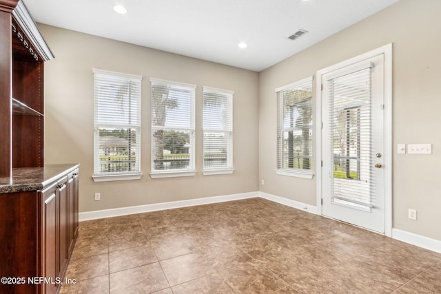 1306 Warbler Way, Middleburg, FL 32068 - unfurnished dining area featuring recessed lighting and tile patterned floors