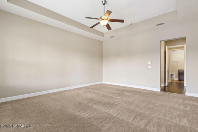 1306 Warbler Way, Middleburg, FL 32068 - carpeted spare room featuring ceiling fan and a raised ceiling