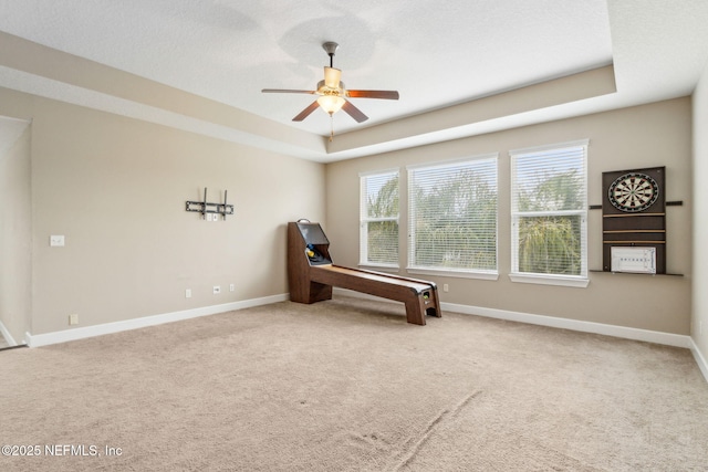 1306 Warbler Way, Middleburg, FL 32068 - unfurnished room featuring a ceiling fan, carpet flooring, and a tray ceiling