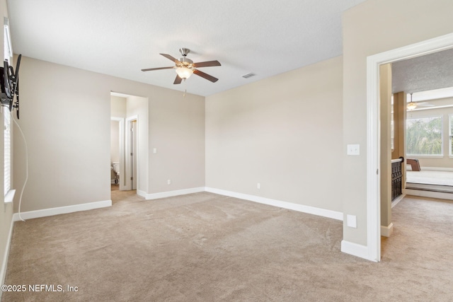 1306 Warbler Way, Middleburg, FL 32068 - unfurnished bedroom with light colored carpet and a ceiling fan
