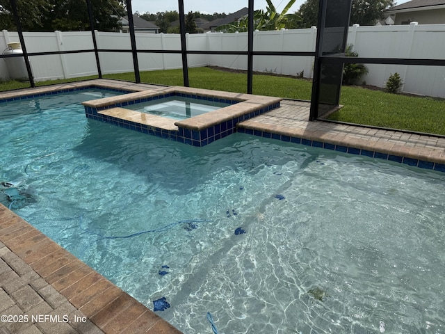 1306 Warbler Way, Middleburg, FL 32068 - view of swimming pool with a lanai, a fenced backyard, and a pool with connected hot tub
