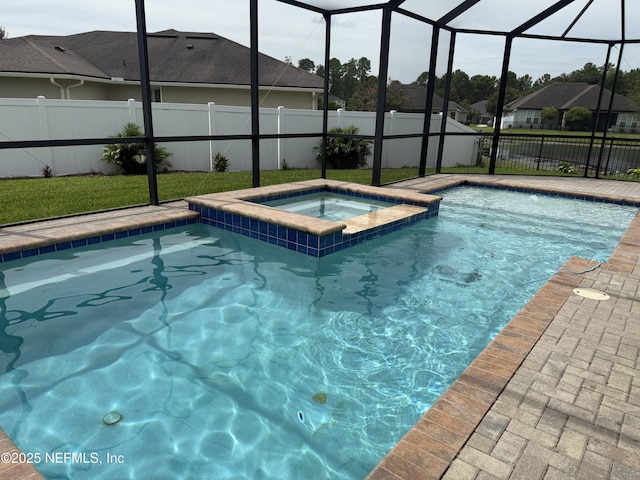 1306 Warbler Way, Middleburg, FL 32068 - view of swimming pool featuring glass enclosure, a fenced backyard, and a pool with connected hot tub