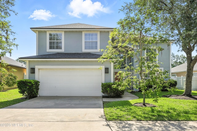 12490 Tropic Dr, Jacksonville, FL 32225 - traditional-style house with a garage, driveway, stucco siding, a front lawn, and a shingled roof