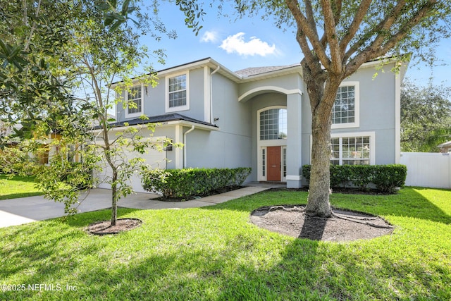 12490 Tropic Dr, Jacksonville, FL 32225 - traditional home with stucco siding, concrete driveway, and an attached garage