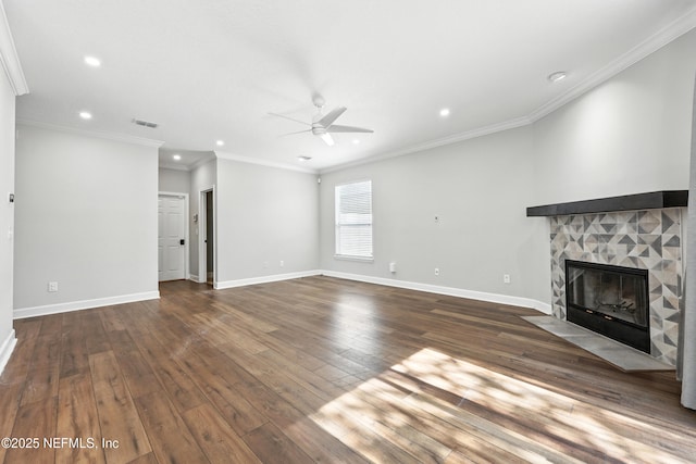 12490 Tropic Dr, Jacksonville, FL 32225 - unfurnished living room featuring ceiling fan, recessed lighting, a stone fireplace, wood-type flooring, and crown molding