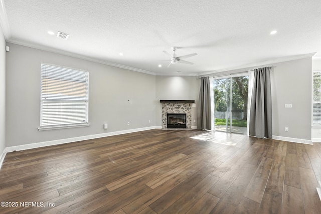 12490 Tropic Dr, Jacksonville, FL 32225 - unfurnished living room with ornamental molding, ceiling fan, a fireplace, dark wood-style floors, and a textured ceiling