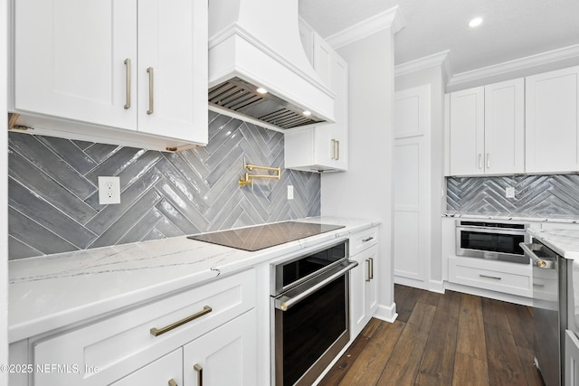 12490 Tropic Dr, Jacksonville, FL 32225 - kitchen with appliances with stainless steel finishes, custom range hood, ornamental molding, backsplash, and light stone countertops