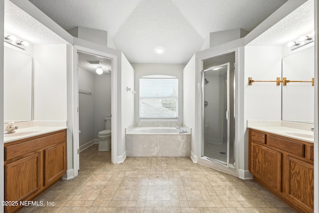 12490 Tropic Dr, Jacksonville, FL 32225 - bathroom featuring a garden tub, a textured ceiling, a stall shower, two vanities, and stone finish flooring