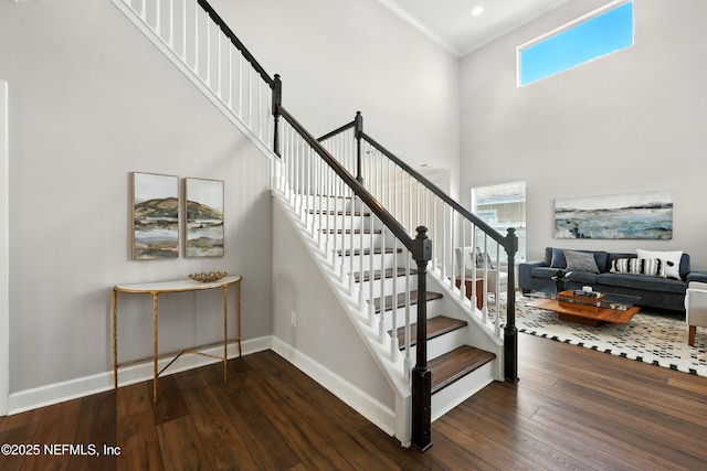 12490 Tropic Dr, Jacksonville, FL 32225 - stairway featuring hardwood / wood-style floors, crown molding, healthy amount of natural light, and a towering ceiling
