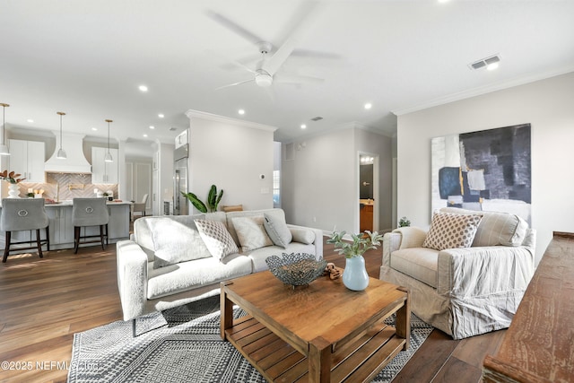 12490 Tropic Dr, Jacksonville, FL 32225 - living room with a ceiling fan, dark wood finished floors, recessed lighting, and ornamental molding