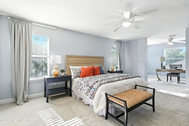 12490 Tropic Dr, Jacksonville, FL 32225 - bedroom with multiple windows, a textured ceiling, carpet, and a ceiling fan