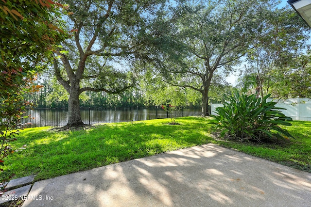 12490 Tropic Dr, Jacksonville, FL 32225 - fenced backyard with a water view and a patio