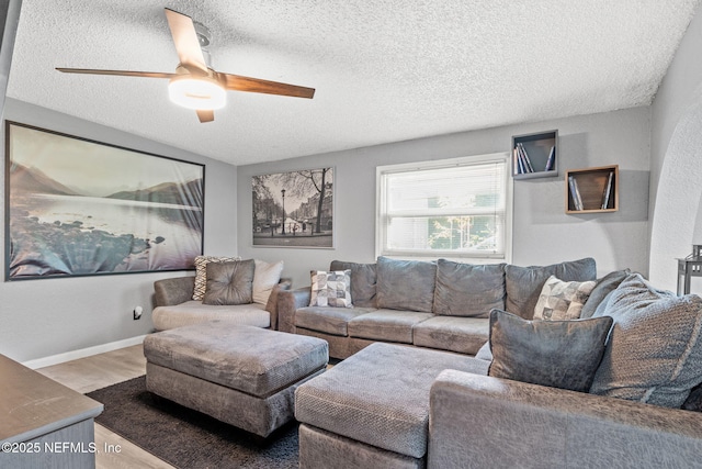 5414 Cleveland Rd, Jacksonville, FL 32209 - living area with wood finished floors, a textured ceiling, and a ceiling fan