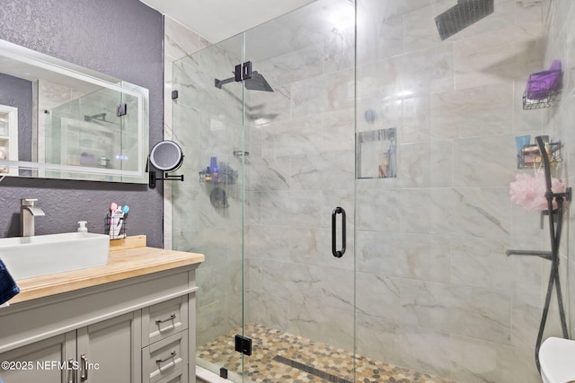 5414 Cleveland Rd, Jacksonville, FL 32209 - full bathroom with vanity, a stall shower, and a textured wall