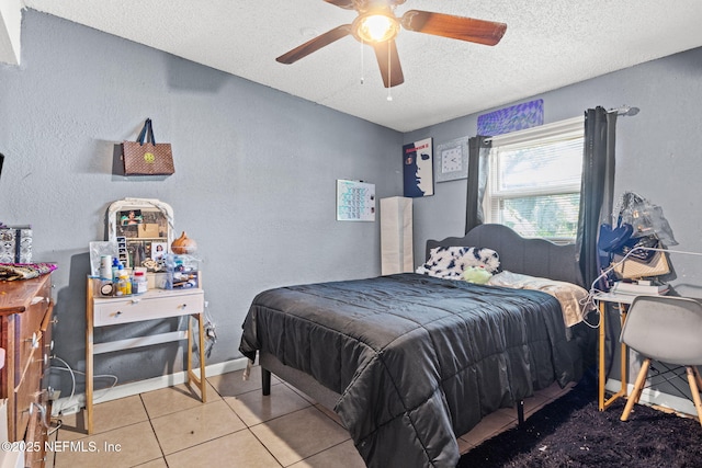 5414 Cleveland Rd, Jacksonville, FL 32209 - tiled bedroom featuring a textured ceiling, a ceiling fan, and a textured wall